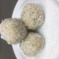 Nariyal Laddu · Creamy blend of Coconut, Almond, Cashew, Pistachio, Poppy Seeds, Cardamom, Cream of Wheat, P...