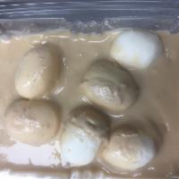 Rasmalai · Small rasgulla balls in rich milk cream with sugar.  (6 balls)
