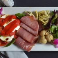 Cold Antipasto · Assorted cold meats and cheeses, roasted red peppers tomatoes, and olives, topped with olive...