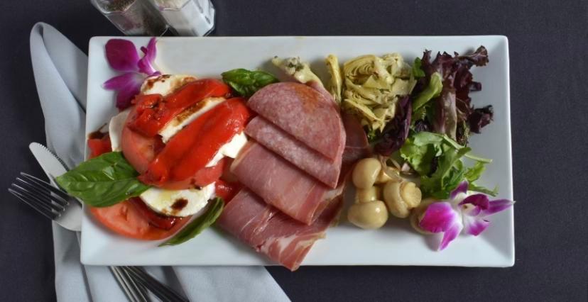 Cold Antipasto · Assorted cold meats and cheeses, roasted red peppers tomatoes, and olives, topped with olive oil.