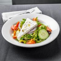 Classic Greek Salad  · Tomatoes, cucumbers, romaine, onions, peppers olives, feta, drizzled with vinaigrette dressi...