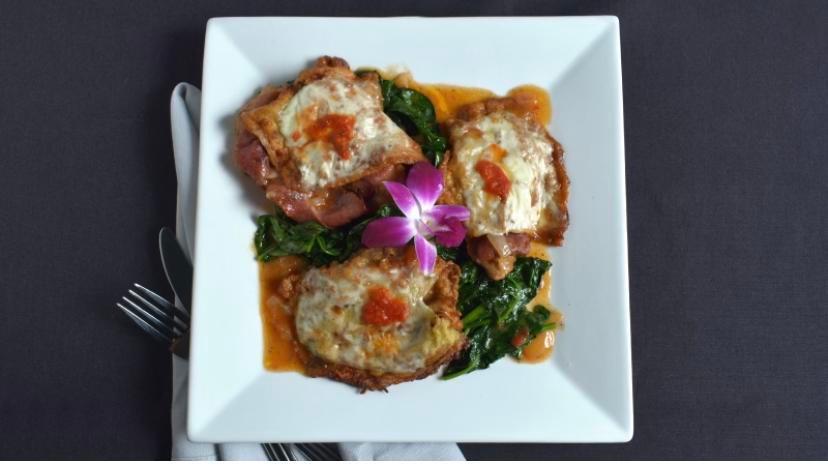 Chicken Sorrentino · Pounded thin, topped with prosciutto, eggplant mozzarella, light brown sauce. Served with sauteed vegetables and oven roasted potatoes