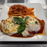 Chicken Parmigiana  · Melted mozzarella and tomato sauce served with spaghetti.