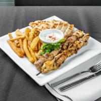 Chicken Souvlaki Platter  · Served with fresh grilled pita bread, red onion, tomatoes and tzatziki sauce. Marinated and ...