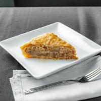 Baklava  · Light crispy sheets of phyllo dough drizzled in honey and layered with nuts.