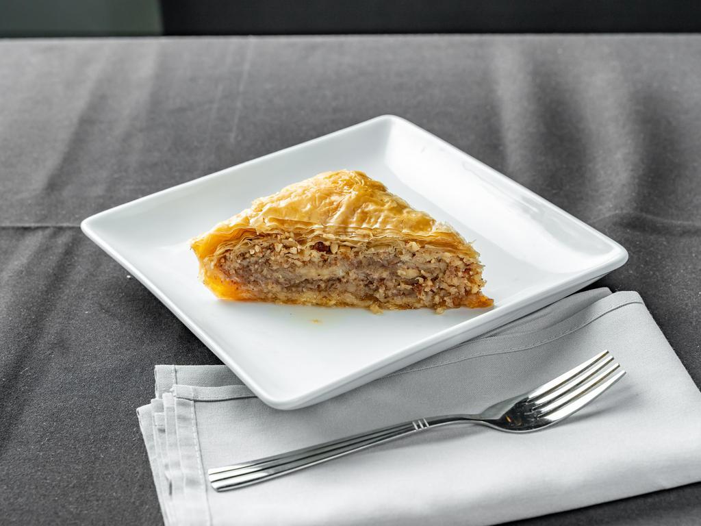 Baklava  · Light crispy sheets of phyllo dough drizzled in honey and layered with nuts.