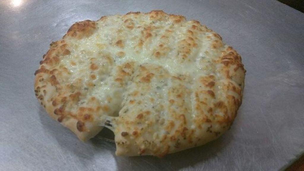 Cheese Bread Stix · Strips of baked dough smothered in butter and cheese.