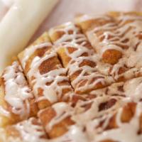 Sin Stix · Strips of fresh baked dough covered with butter, smothered with cinnamon, sugar and loaded w...