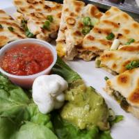 Pitadilla · Quesadilla made with pita bread cheese onions, peppers and taco meat