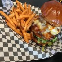 Texas Burger Basket · 1/3 lb. cheeseburger with bacon and ham and fried egg served with lettuce, tomato and a onio...