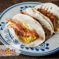 Egg and Bacon Taco · Folded tortilla with a variety of fillings such as meat or beans. 