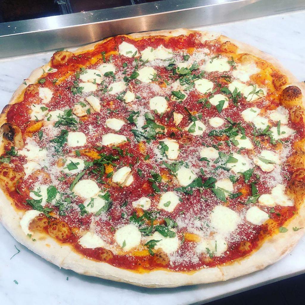 Magharita Pizza · 100% Fresh mozzarella, Basil, Parmesan Cheese, and Extra Virgin Olive Oil.