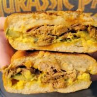 Cuban Sandwich · Braised pork shoulder with ham, Swiss cheese, pickles and mayo must.