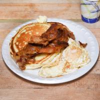2. Pancakes Breakfast · 2 eggs any style, bacon, sausage or ham, regular coffee and tea or juice.