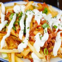 Loaded Fries · French fries topped with cheese sauce, bacon, chives, and sour cream.