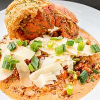 Cajun Seafood ＆ Grits · Gulf shrimp and lobster claw meat sauteed in bell peppers, bacon, and white wine tossed in a...