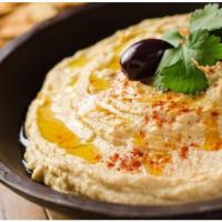 Hummus  · Mashed chickpeas blended with tahini, garlic, olive oil and lemon juice
