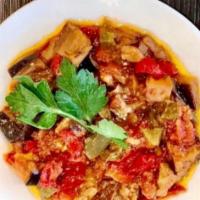 Eggplant Salad  · Pieces of eggplant, fresh tomato sauce, peppers, onions, garlic and parsley
