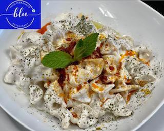 Turkish Dumpling-Manti  · Filled with ground beef and herbs topped with garlic yogurt butter sauce. 