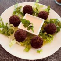 Falafel  · Seasoned, deep fried mashed chickpeas and parsley 