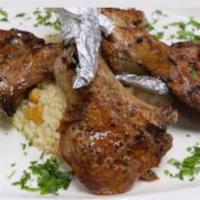 Baby Lamb Chops  ·  Char-grilled baby lamb chops served with house salad and rice 