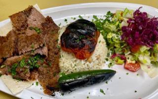 Gyro  ·  Marinated beef, lamb mix and vertically cooked served with house salad and rice 