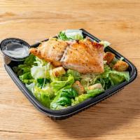 Salmon Caesar Salad - Full Size · Leafy Romaine lettuce accompanied with Caesar dressing garnished with parmesan cheese and se...