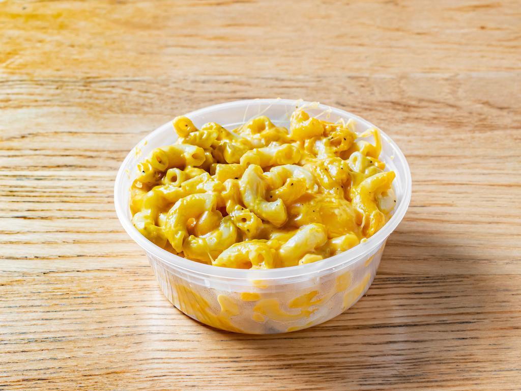 Magnificent Macaroni & Cheese (a la carte) · Elbow macaroni covered in a creamy three cheese sauce and baked to a golden brown