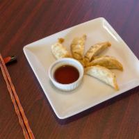 Gyoza · 5 dumplings filled with ground chicken and cabbage.