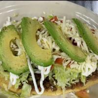 Huaraches · Choice of meat, topped with beans, melted cheese, lettuce, tomatoes, mayonnaise, and avocado.