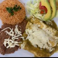 Enchilada Plate Plate · 4 chicken enchiladas with ranchero sauce along with rice, beans, and a small salad.