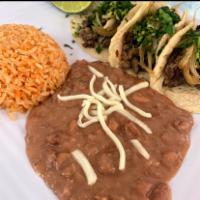 Taco Plate · 3 tacos with choice of meat. Served with rice and beans.