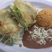 Gordita o Sope Plate  · 2 gorditas or2 sopes with choice of meat. Served with rice and beans.