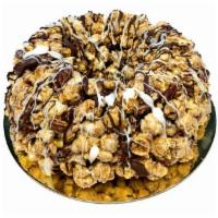 Caramel Pecan Marshmallow Popcorn Cake with Chocolate Drizzle · Caramel pecan popcorn cake with chocolate drizzle. Made with our famous caramel pecan popcor...