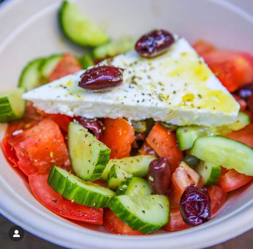 Greek Salad · Tomatoes, onions, olives, feta cheese, olive oil, oregano & capers.