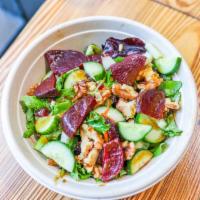 Mykonos Salad · Super greens, cucumbers, broccoli, carrots, green apples, nuts & balsamic vinegar dressing.