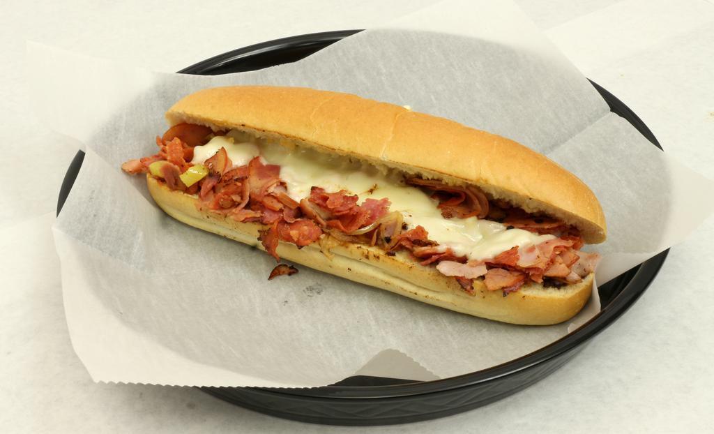 Italian Hottie Sub · Grilled salami, pepperoni, ham, onion and melted provolone. Dressed with banana peppers, oregano and golden Italian dressing. Mayo, lettuce and tomato.