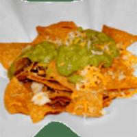 Cheese and Guacamole Nachos · Served with guacamole.