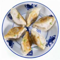 Pan-Fried Pork Dumplings 生煎鲜肉锅贴 · Stuffed dough. 