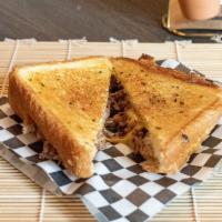 Texas Grilled Cheese · Smoked brisket, cheddar and provolone cheese served on a Texas toast.