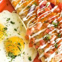 Breakfast Quesadilla Sunny Eggs · Flour tortilla stuffed with blackened chicken, black beans and cheddar cheese. Topped with p...