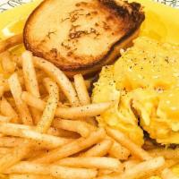 Breakfast Sandwich · Two scrambled eggs topped with American cheese on a toasted potato roll. Served with your ch...