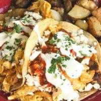 Breakfast Tacos · Two corn tortillas stuffed with chorizo, scrambled eggs, topped with rojo salsa, queso fresc...