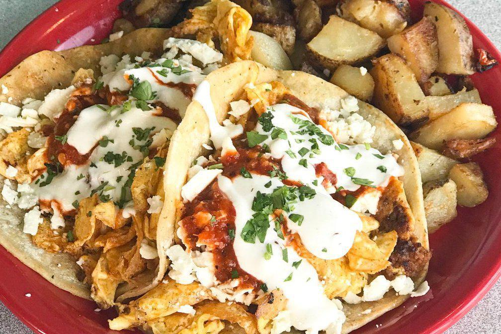Breakfast Tacos · Two corn tortillas stuffed with chorizo, scrambled eggs, topped with rojo salsa, queso fresco and a drizzle of crema. Served with HOE fries. HOE fries can be substituted with any lunch side for the listed up-charge.