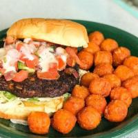 Black Bean Burger Sandwich · Grilled black bean burger on a toasted potato rolland a bed of lettuce. Topped with queso an...