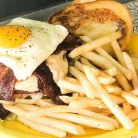 Hoe Burger Sunny Egg · Fresh ground beef grilled and topped with red onion jam, swiss cheese spread, bacon aoli and...