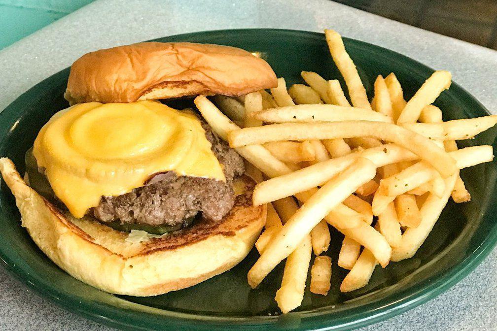 OG Burger · Fresh ground beef with grilled onion, topped with melted american cheese and sliced picked on a toasted potato roll.