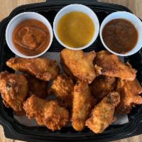 Chicken Wings · Deep fried and seasoned with Little Porky's chicken rub. Choice of 1  of our sauce per six w...