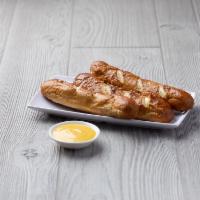 Bavarian Pretzels · 3 Jumbo pretzel rods fried to perfection and sprinkled with pretzel salt. Served with your c...