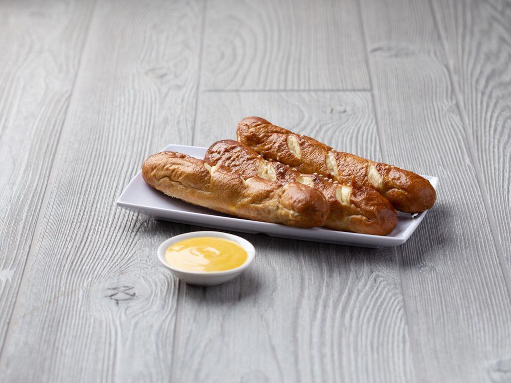 Bavarian Pretzels · 3 Jumbo pretzel rods fried to perfection and sprinkled with pretzel salt. Served with your choice of cheese sauce or dijon mustard.